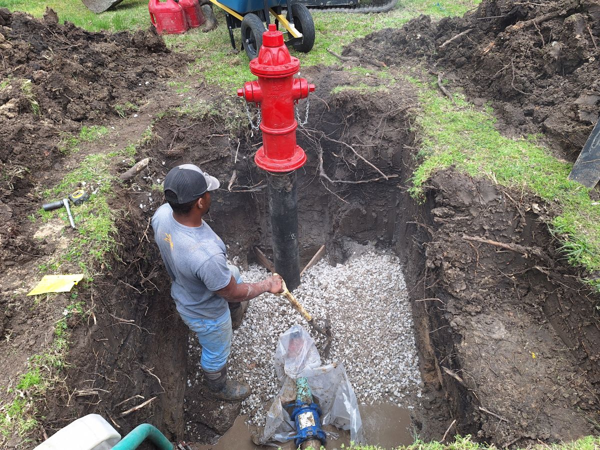 New hydrant and valve in place and starting to backfill will rock before dirt