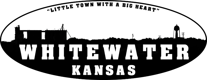 Shows the Elevator and Watertower above the treeline, A little town with a big heart, Whitewater Kansas