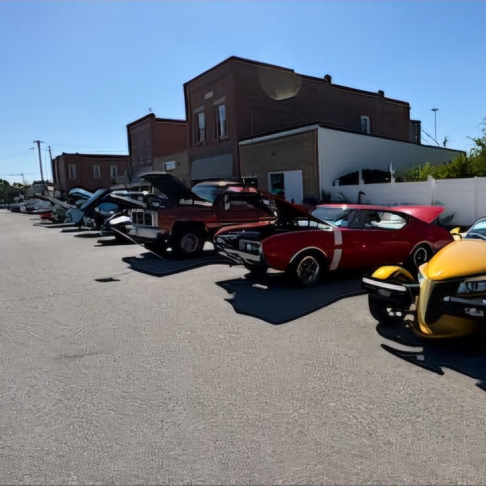 variety of cars on display along main street for a car show