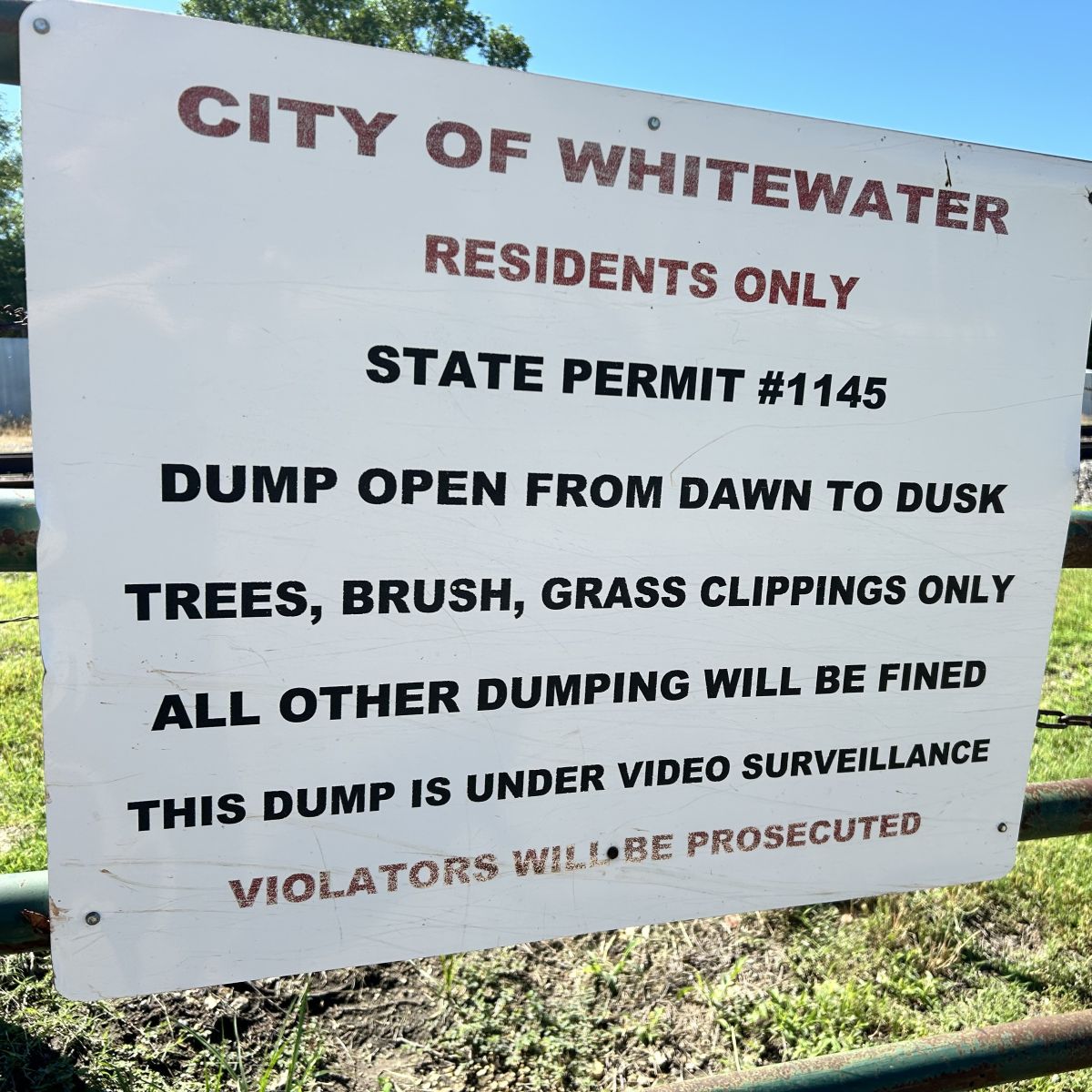 sign stating when open and what is allowed to be dumped for city residents only