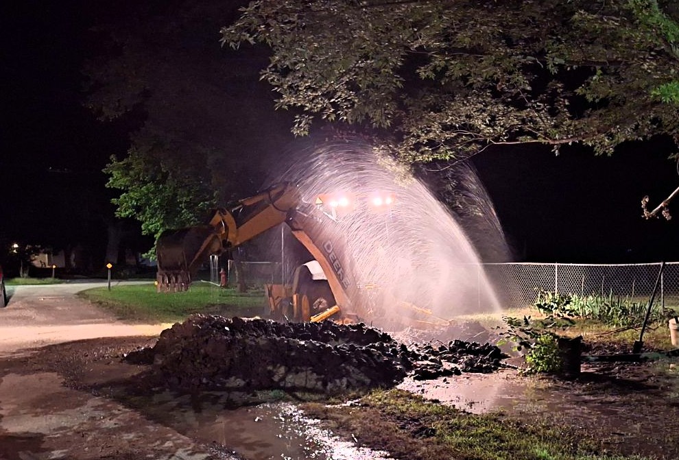 water spraying during water main repairs at night