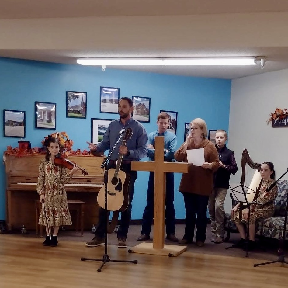 a family providing music for the nursing residents