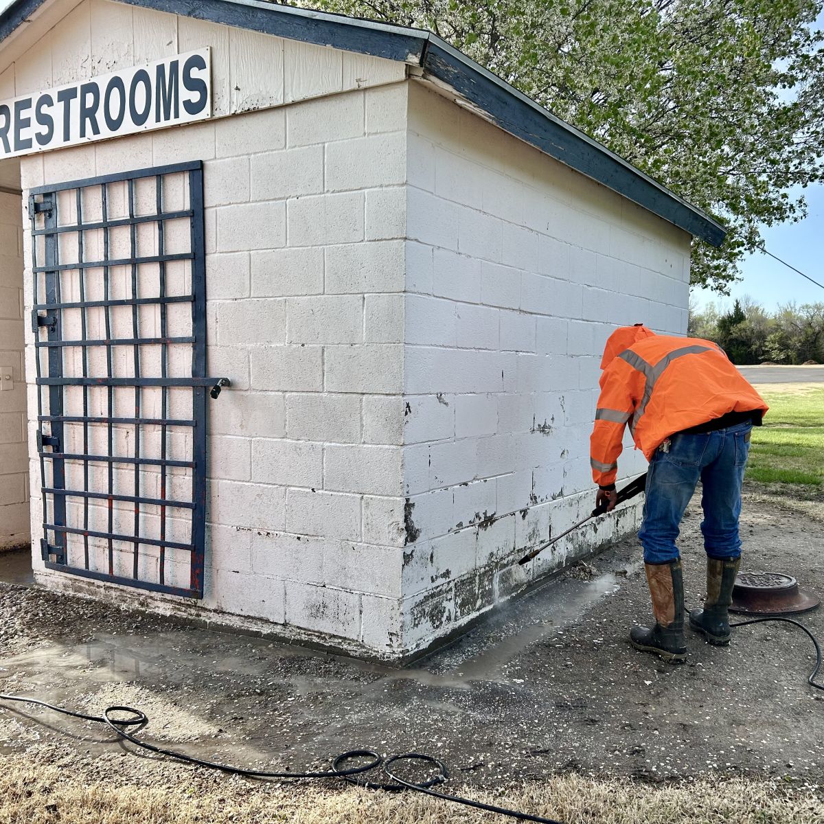 Pressure washing the outside of the building
