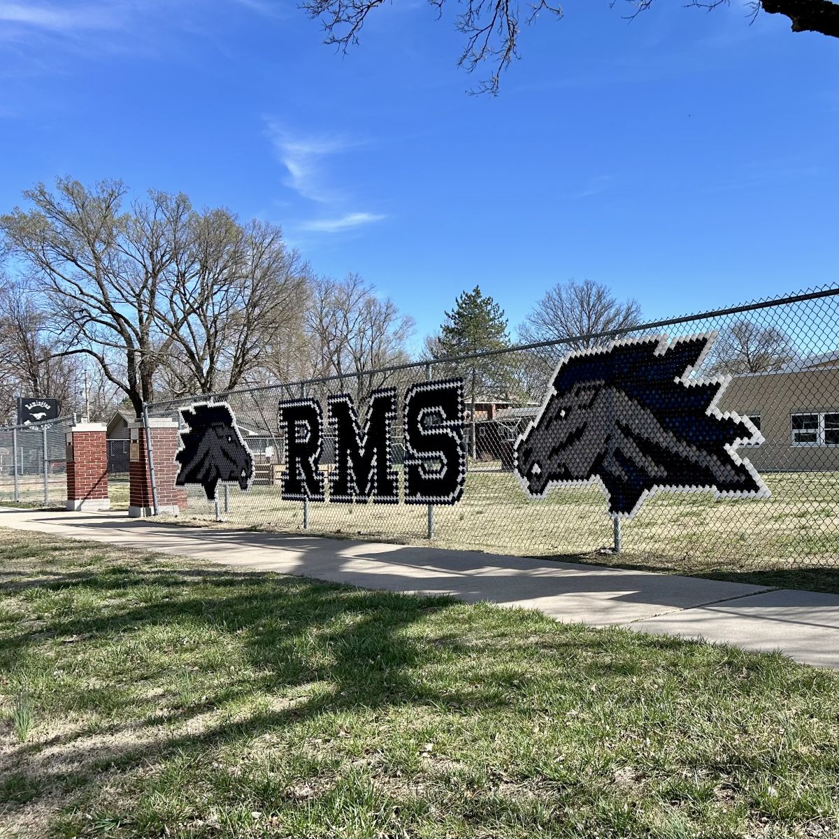 RMS spelled out in the fence