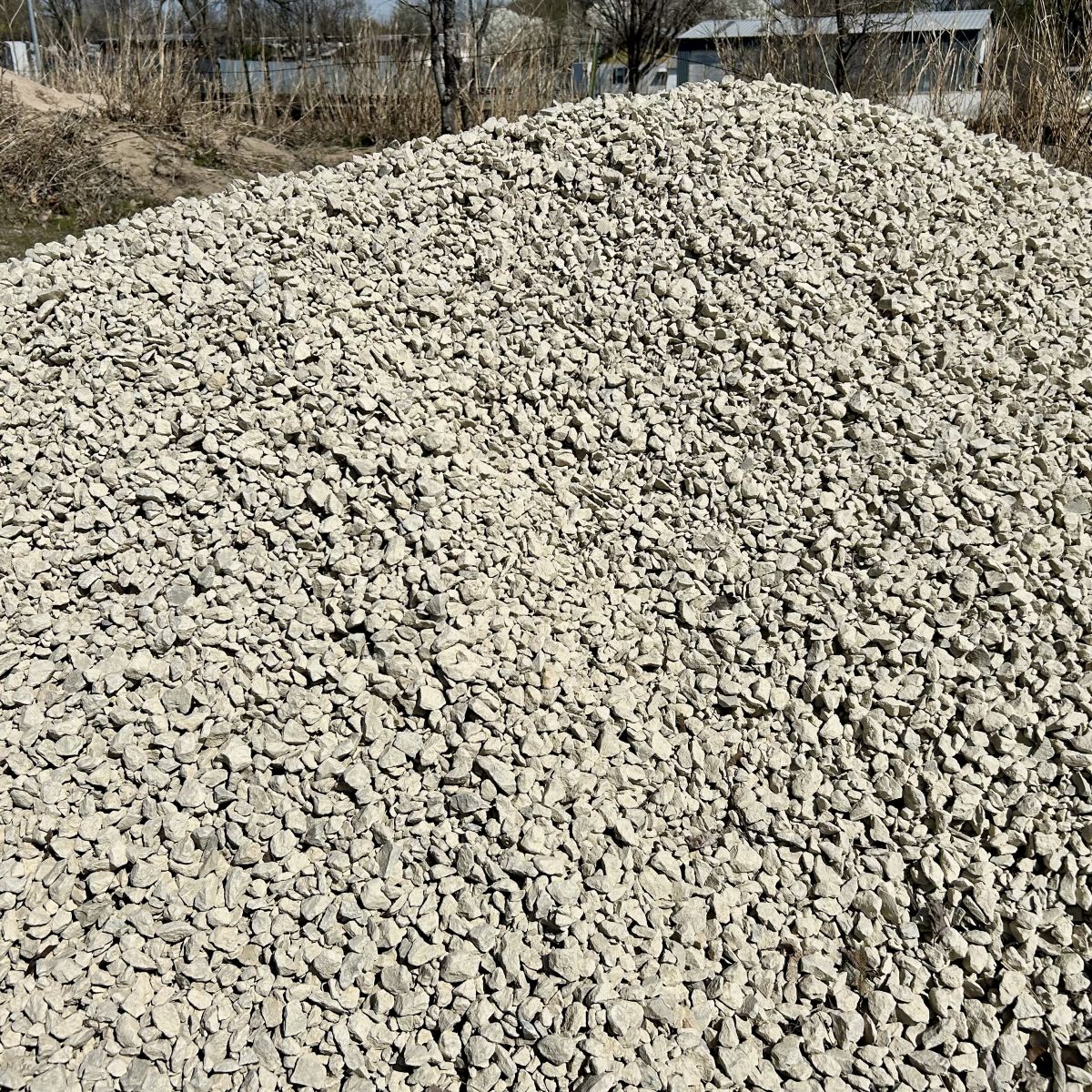small white rock at the dump