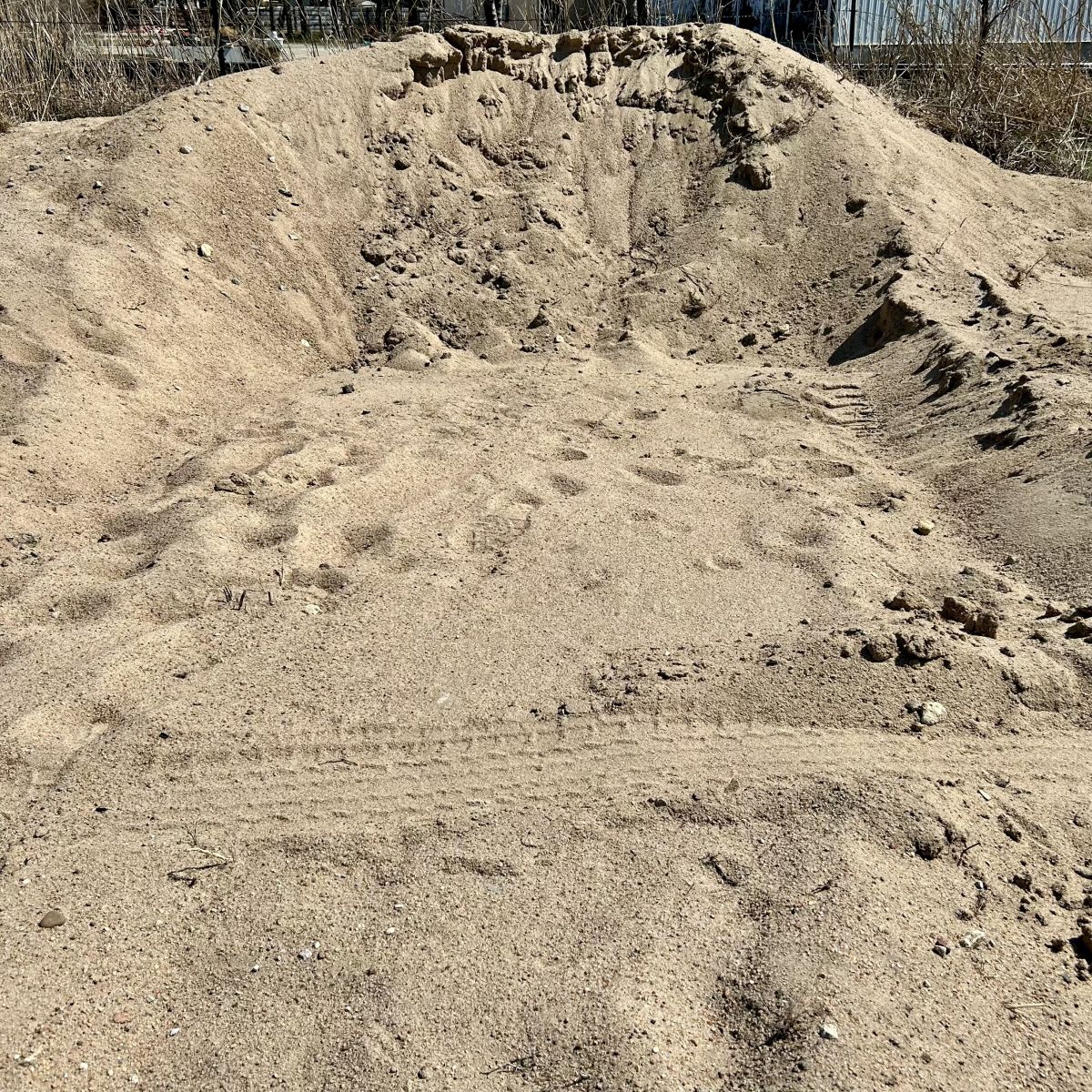 a pile of sand at the dump