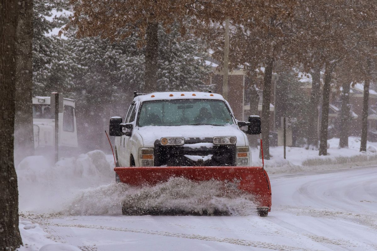 Truck snow plowing a street