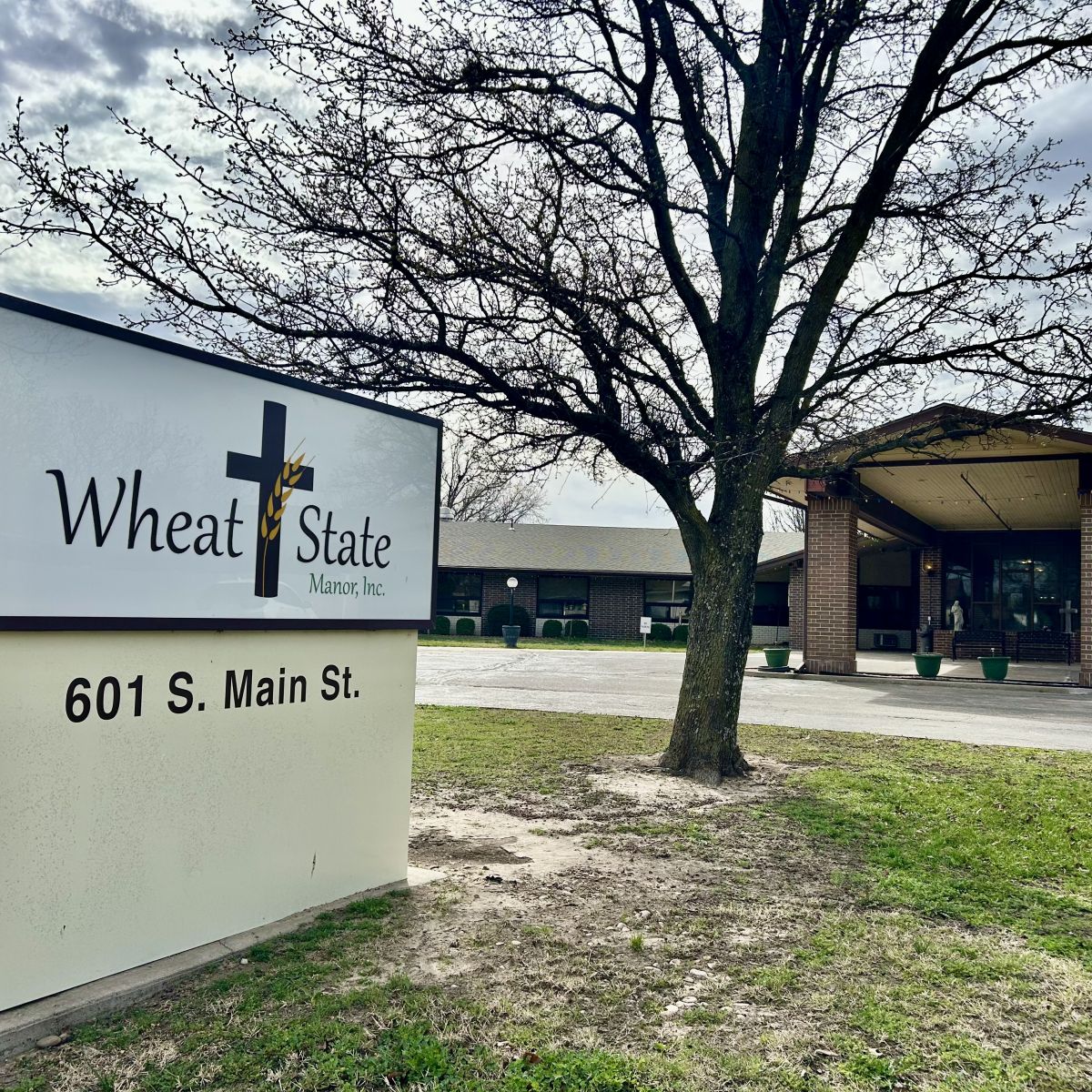 Wheat State Manor sign in front of the drive through entrance area